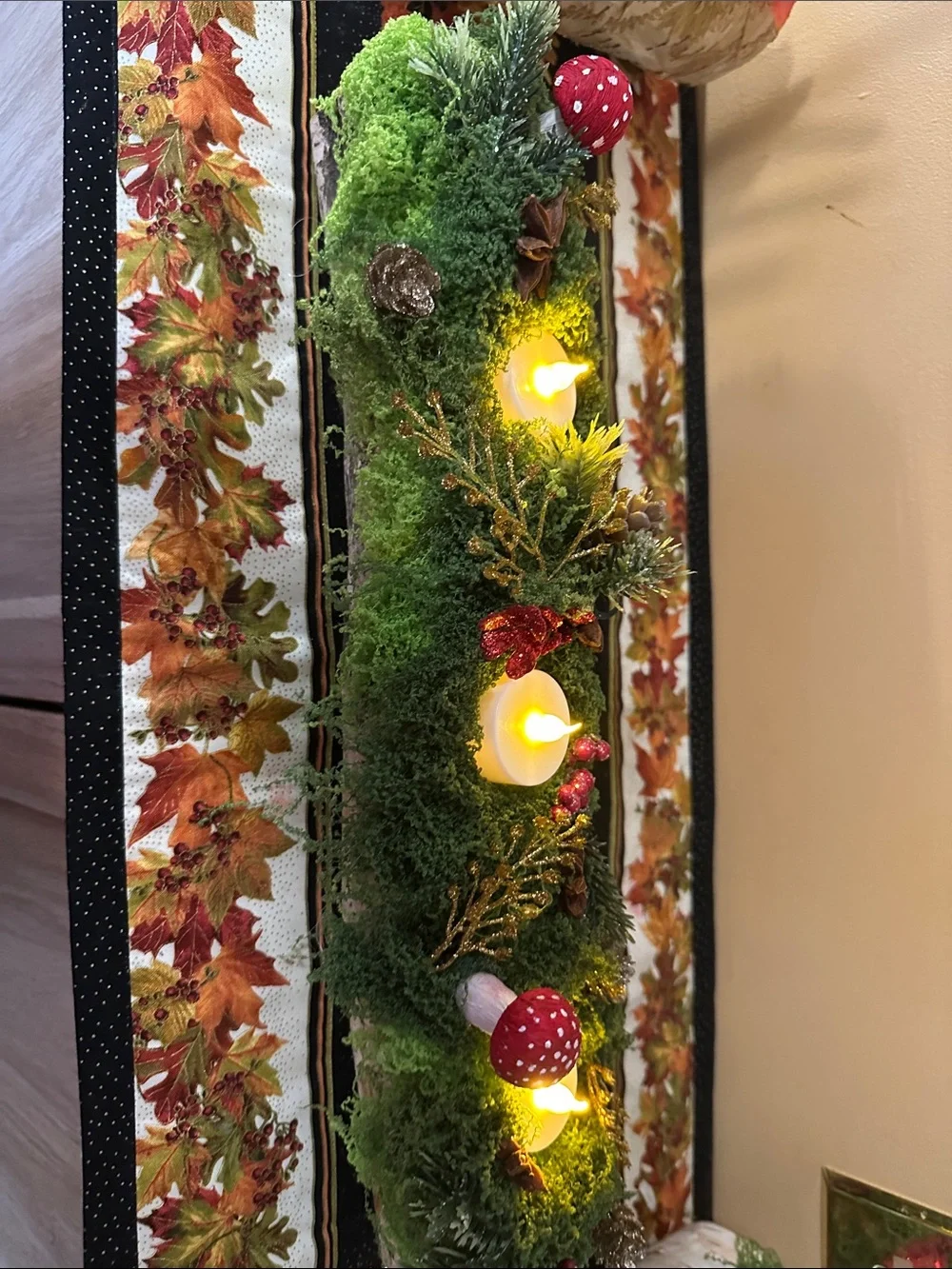 Moss-Covered Holiday Centerpiece with Red Mushroom Accents